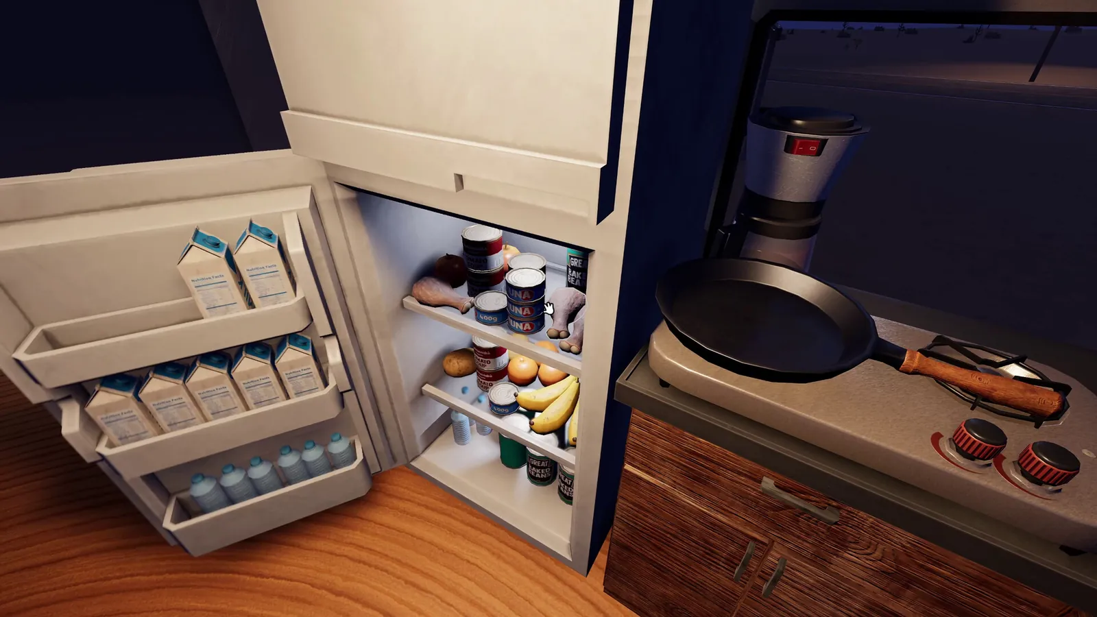 Inside the RV in Nomad Drive: an open fridge stocked with food next to a small stove and a frying pan