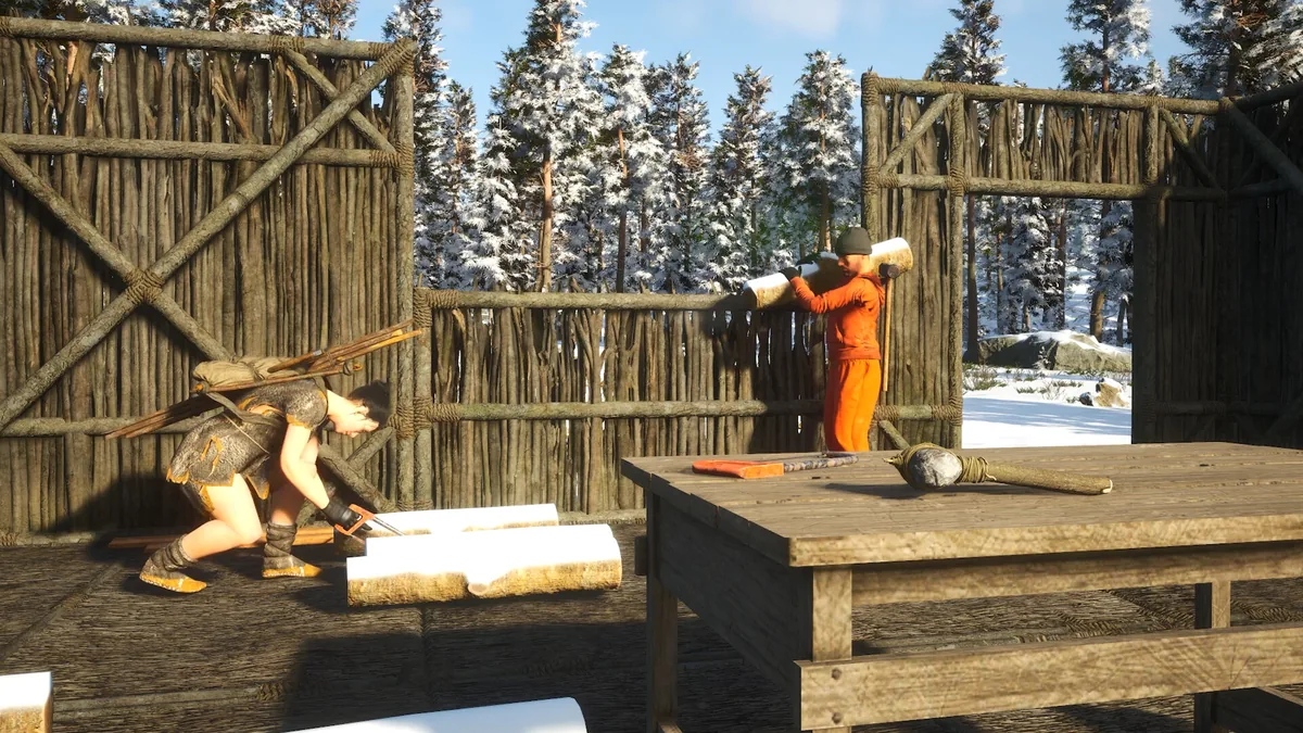 Two SCUM prisoners building a log base in the snow, in the PC game that hasn't reached PS5 or Xbox yet